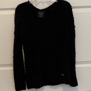 Black V-neck sweater